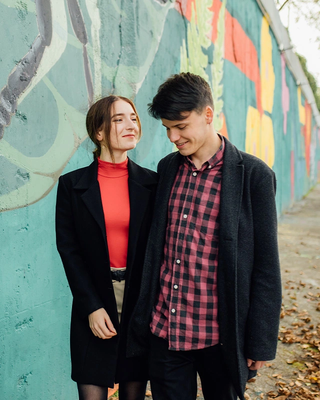 Couple enjoying street art on a first date