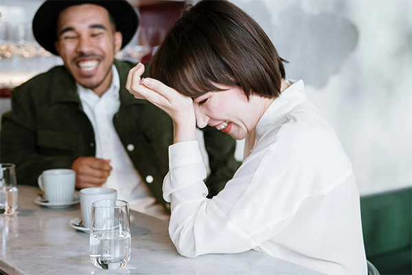 Couple on a first date laughing