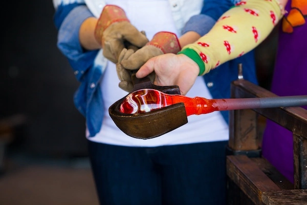 Couple on a first date a glassblowing studio