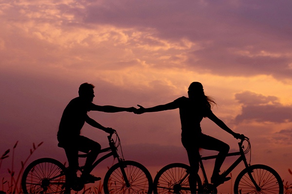 Couple biking at twilight