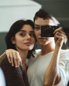 Couple taking a mirror selfie
